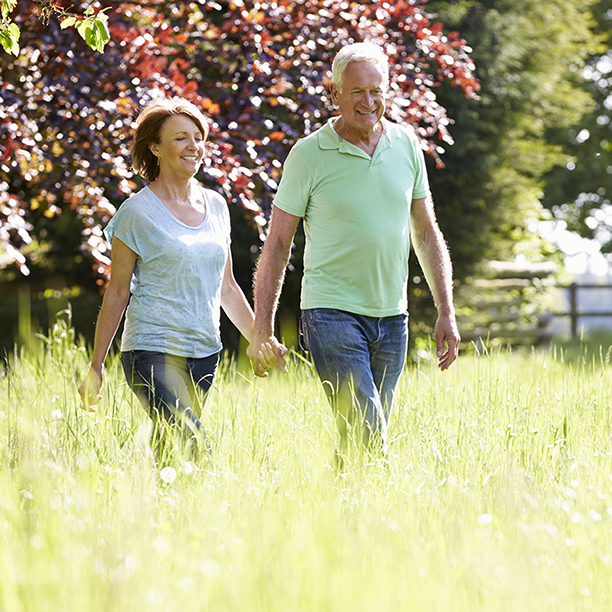 People walking through grass